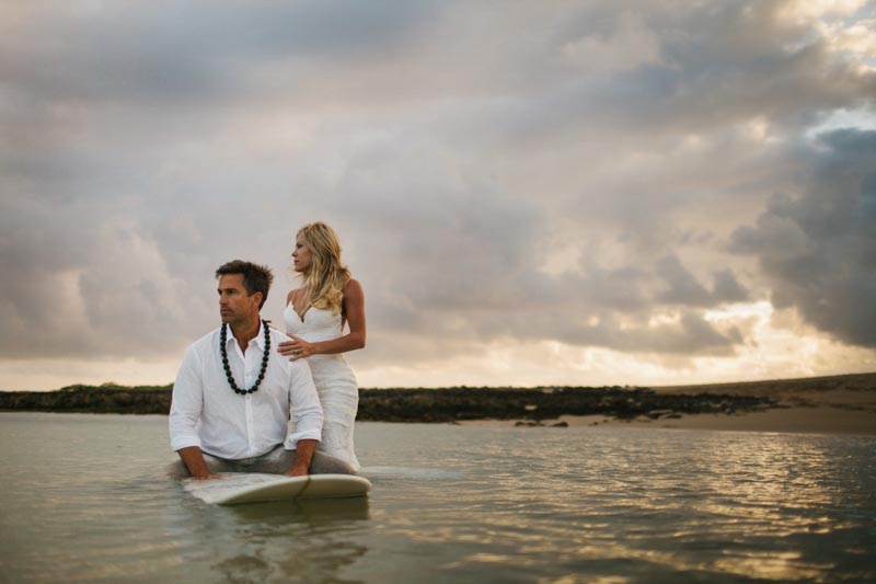 bride and groom surfing wedding dress North Shore, Hawaii