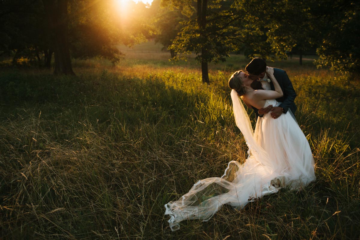 romantic sunset photo of bride and groom