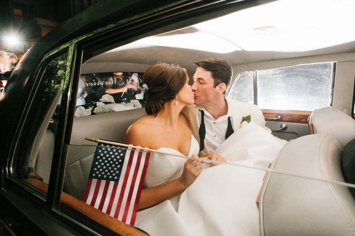 Wedding exit photo old car american flag