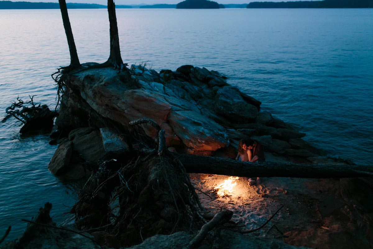 sunset campfire stunning engagement photo lake lanier