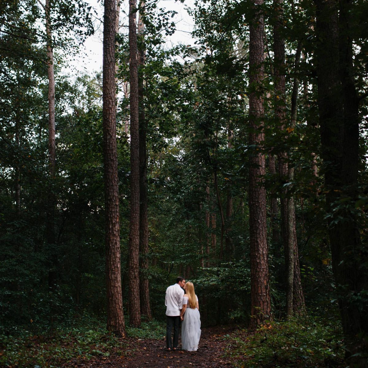 couple in woods engagement
